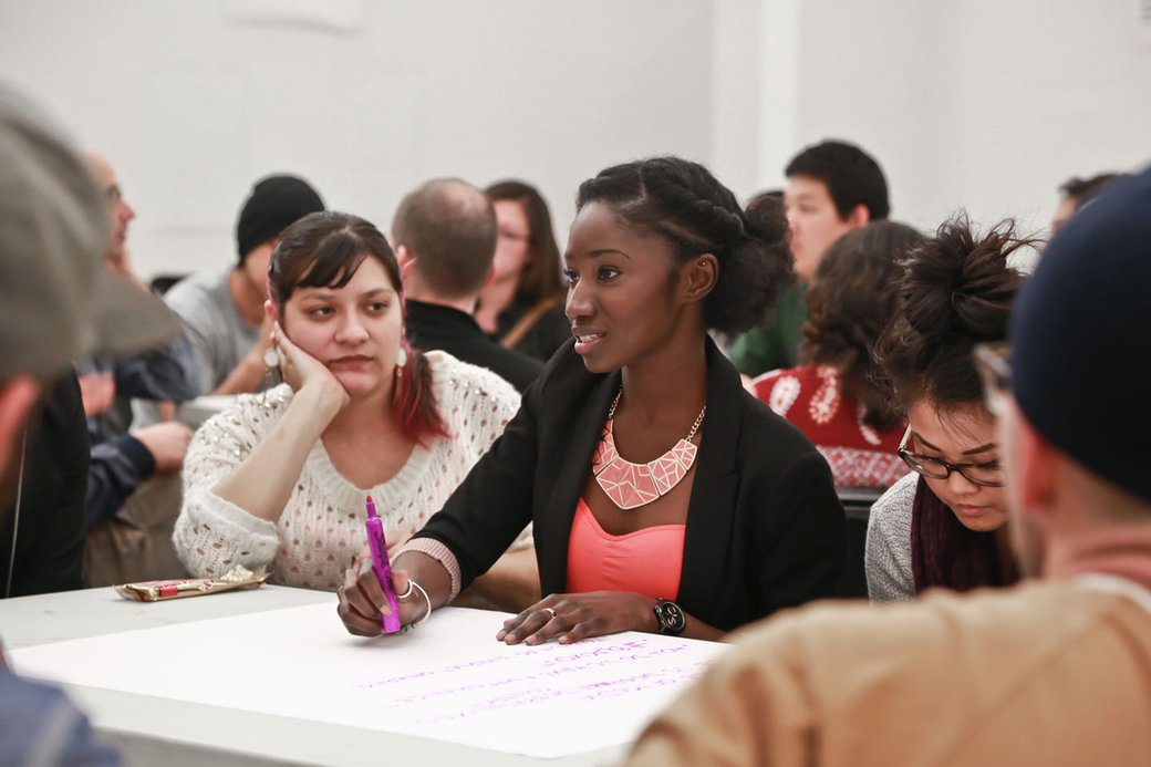 A student teaches people about the Black Lives Matter movement.
