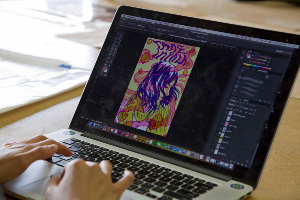 Illustration student designing a 'Tame Impala' graphic poster in adobe illustrator