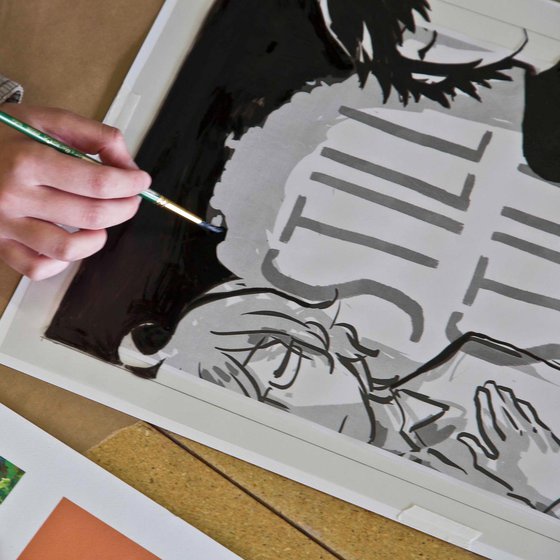 Close up of Illustration student painting a graphic poster