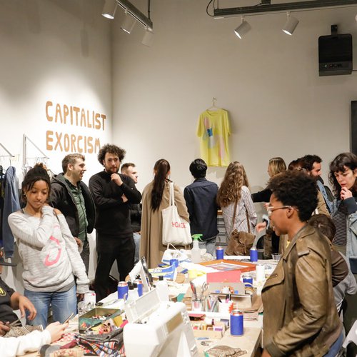 CCA fine arts students lead a "Capitalism Exorcism" activation in the Hubbell Street Galleries.