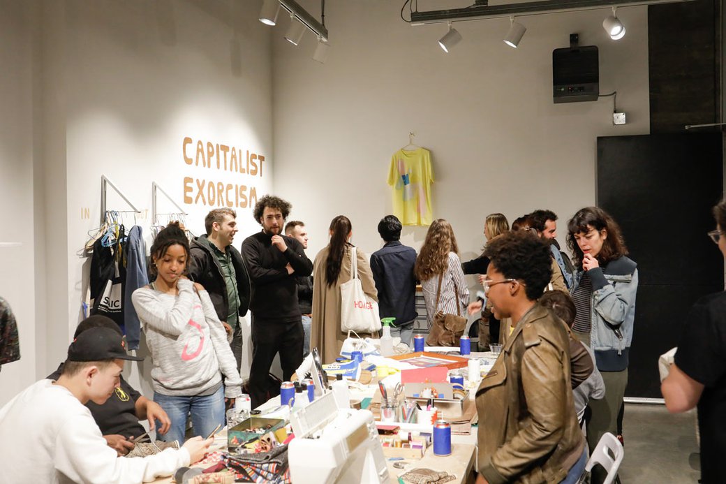 CCA fine arts students lead a "Capitalism Exorcism" activation in the Hubbell Street Galleries.