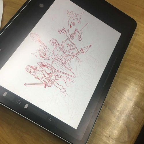 A tablet shows a sketch of medieval characters with swords and armor facing a dragon.