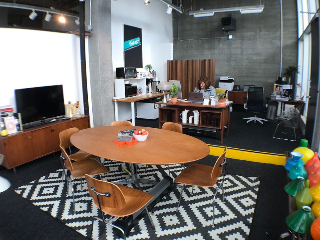 A dining room table sits in the office for the Center.