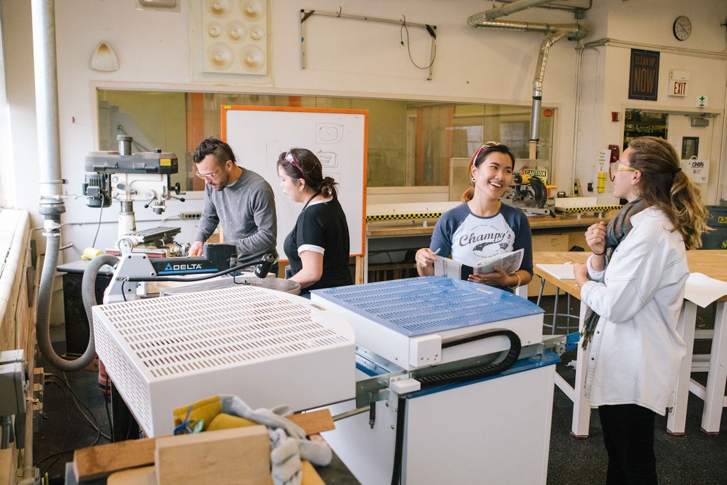 Photograph of students using equipment in the First Year Studios Wood Shop.