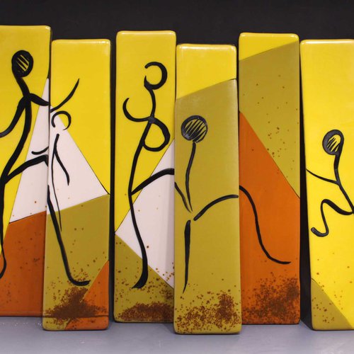 Segments of fused color glass depicting scene of dancing on fire.