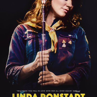 Movie poster for the film Linda Ronstadt: The Sound of My Voice, with the musician standing at the microphone with her head turned.