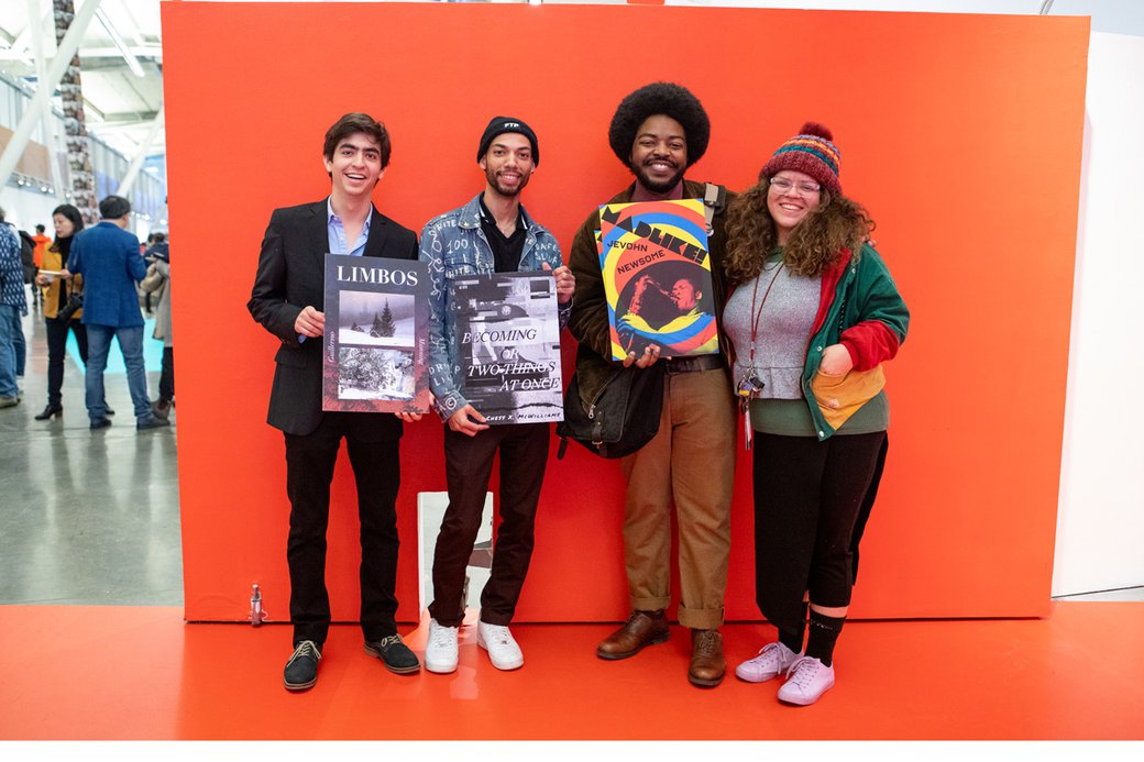 BA writing student award winners pose with their book cover art.