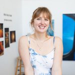 A portrait of the graduate student artist Ingrid Henderson smiling in the MFA Graduate Studios.