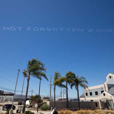 Skytyped message of the words Not Forgotten over Terminal Island in San Diego