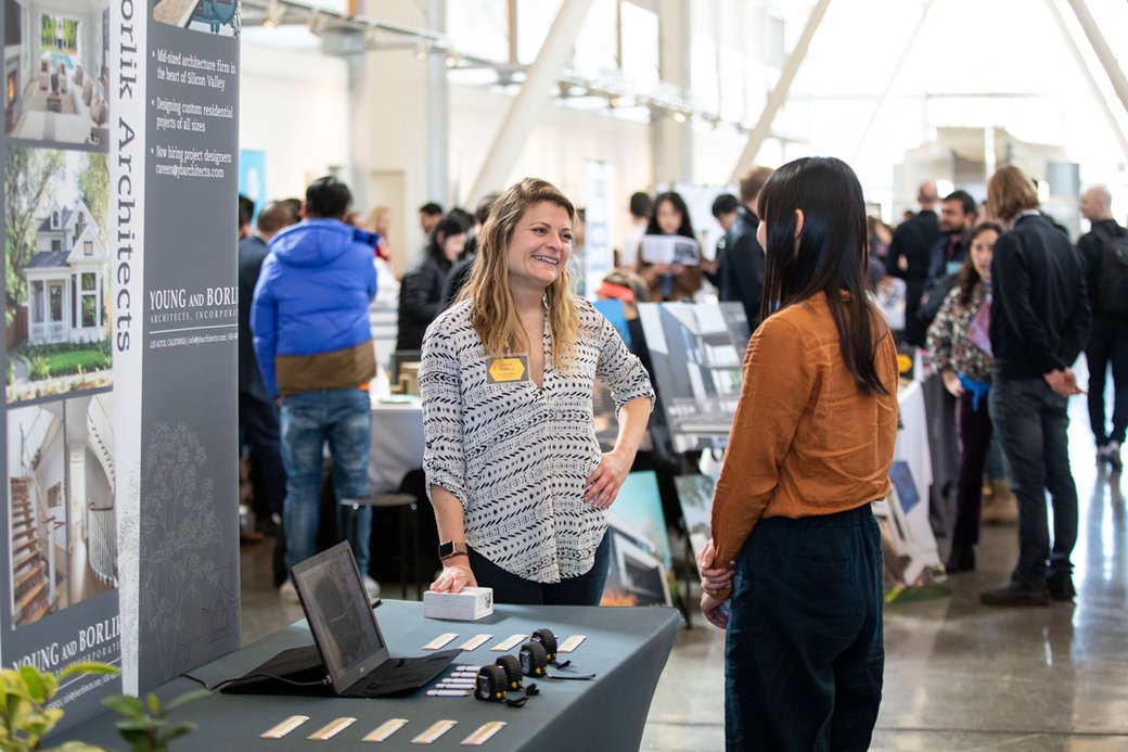 Students connect with prospective employers at the career expo.