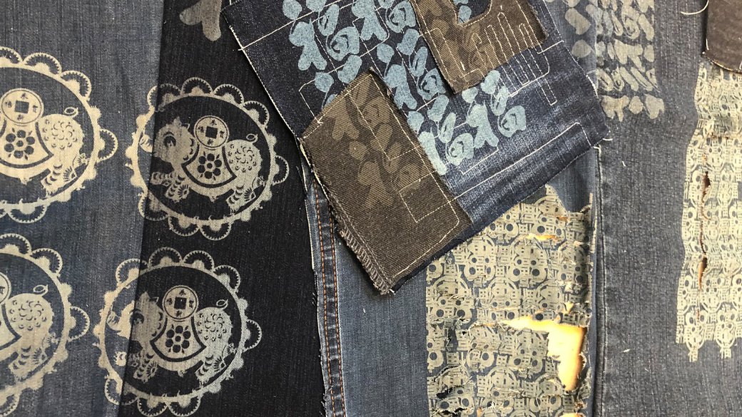 Laser etching design on denim.