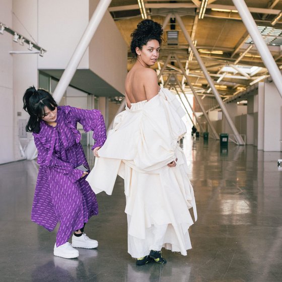 Senior fashion student working with a model in the Nave.