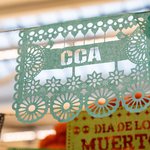 Tissue-paper art in the Mexican style with the letters CCA forming the design.