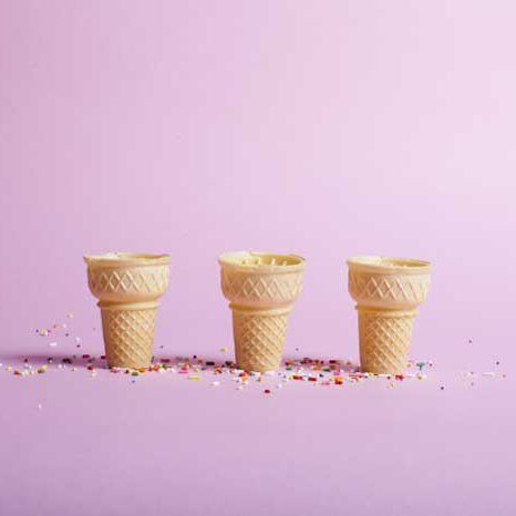 Archival inkjet print of three ice creams cones on a taffy pink background.