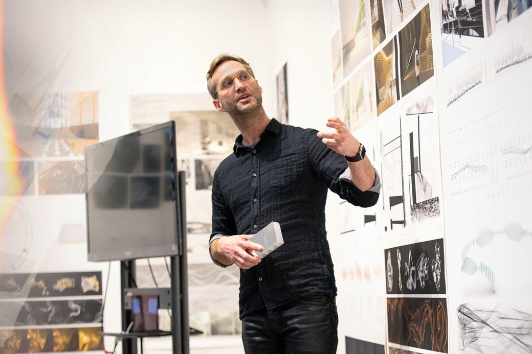 Student presenting his work during final critiques.