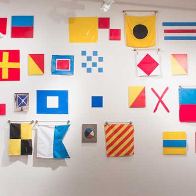 Art with coded message via maritime signal flags.