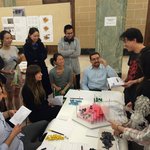 Group of students around "Bordertown" game. Created by Shiyun Fan, Huaye Wei, and Seungah Lee.
