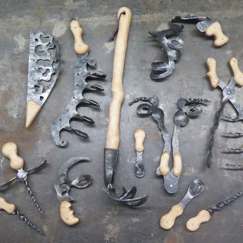 Display of various working tools made from steel and wood.