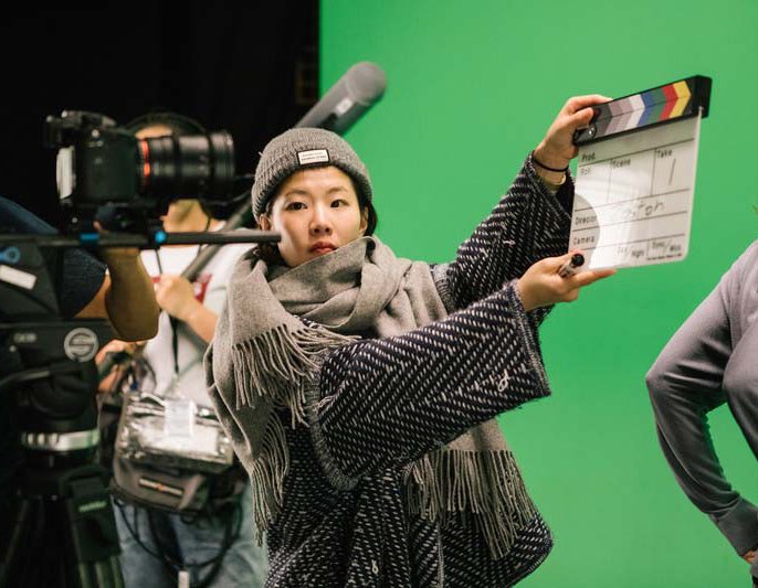 BFA Film student shooting takes in the green screen film cage