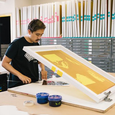 Printmaking students learn to use silkscreens to make prints