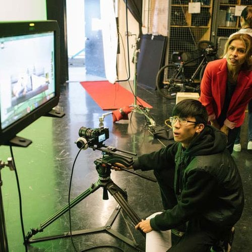 CCA film student shoots on a green screen and reviews footage with faculty
